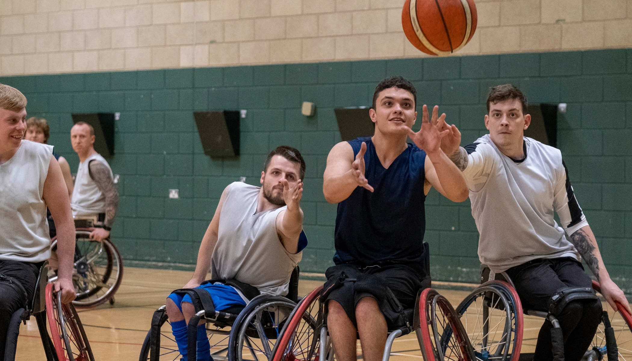 All Abilities wheelchair basketball championship with adult players competing in an indoor arena